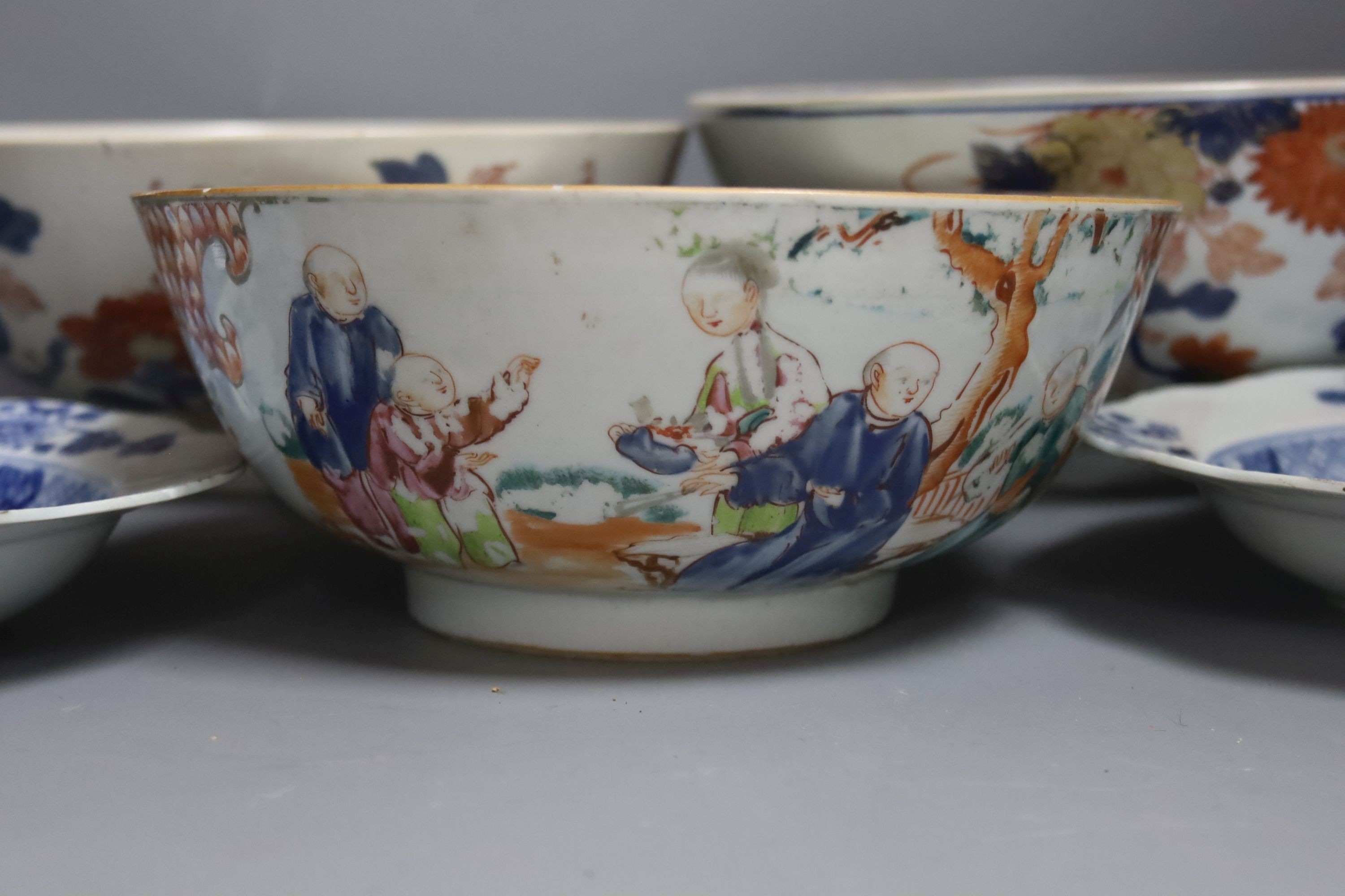 Three 18th century Chinese export porcelain bowls, largest 28 cm and two plates